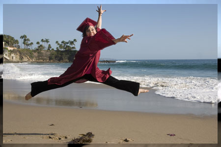 Graduate leap on beach